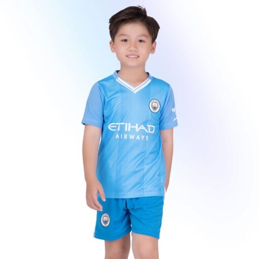 Quần áo bóng đá trẻ em Man City 2024 màu xanh sân nhà Strivend
